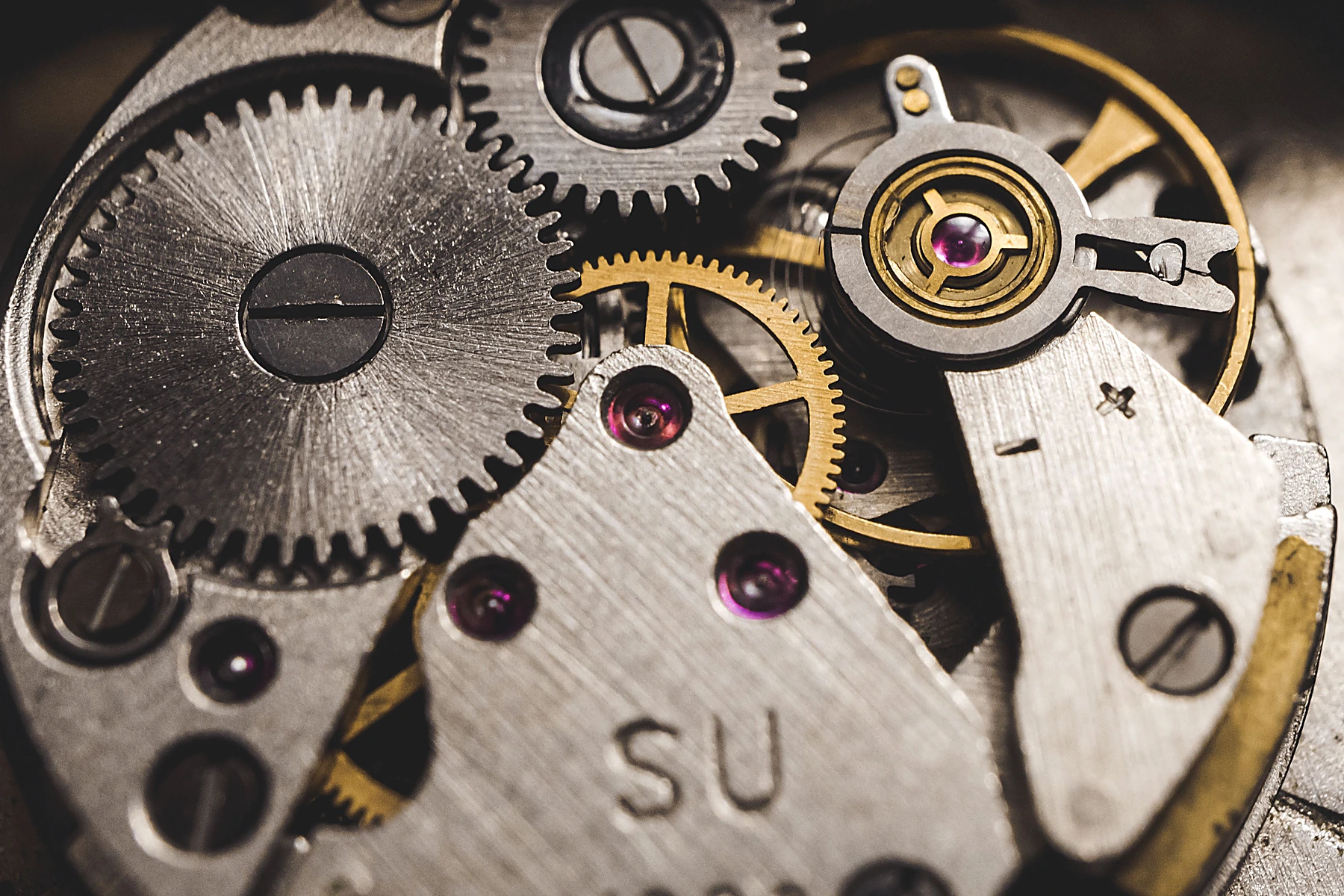 Close-up of precision mechanical clock gears and movement components